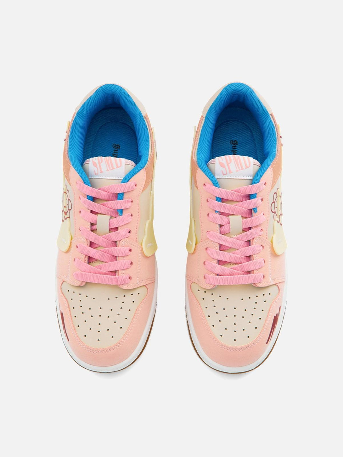 Top view of TALISHKO skate shoes in pink with playful flower graphics and vibrant blue accents.