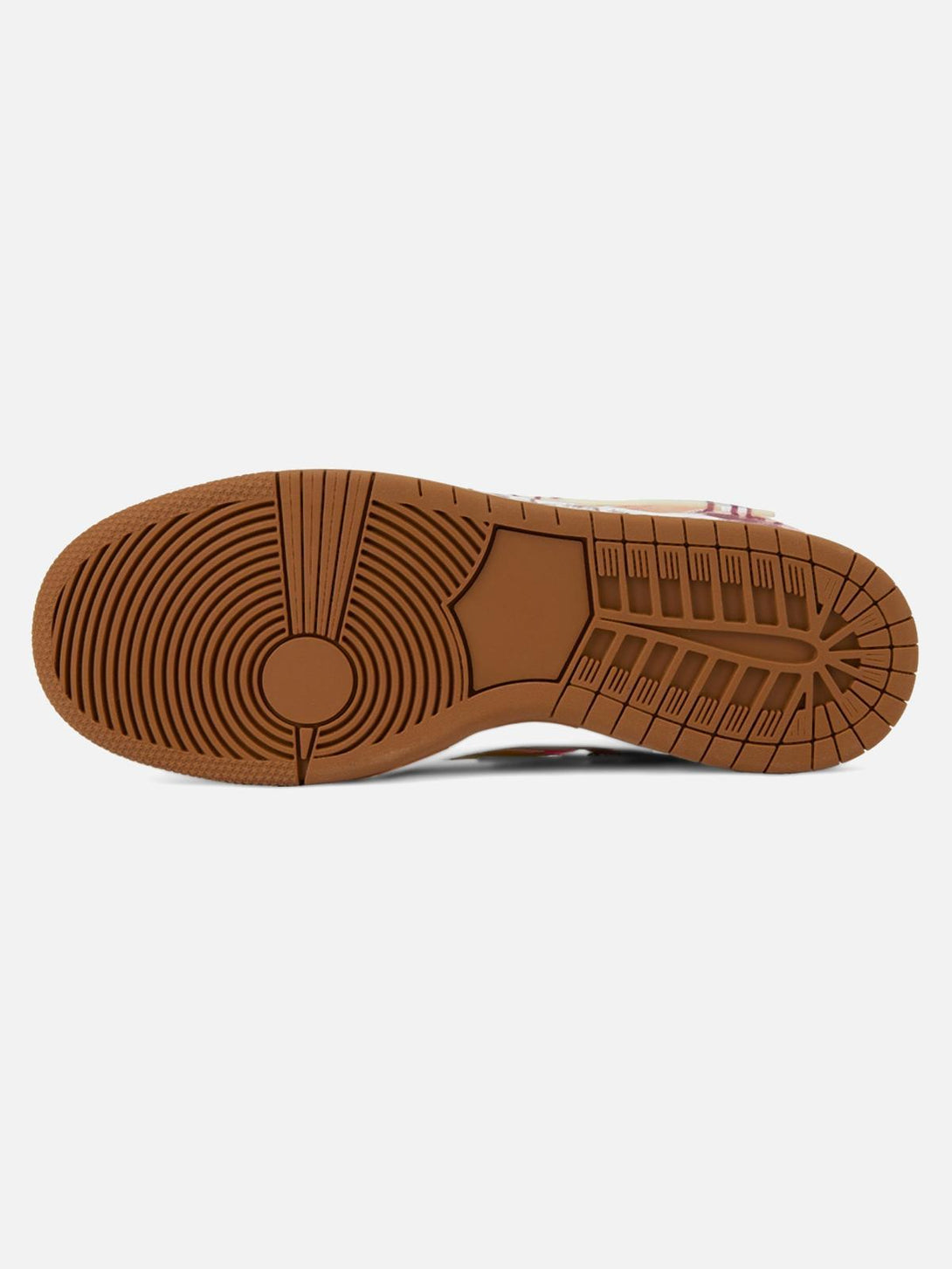 Sole view of TALISHKO skate shoes highlighting durable traction pattern in brown rubber.