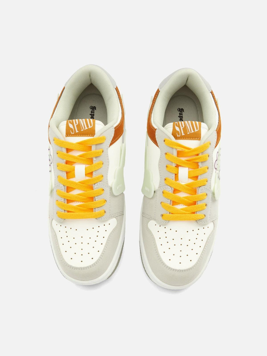 Top view of TALISHKO skate shoes with yellow laces and playful sunflower details.