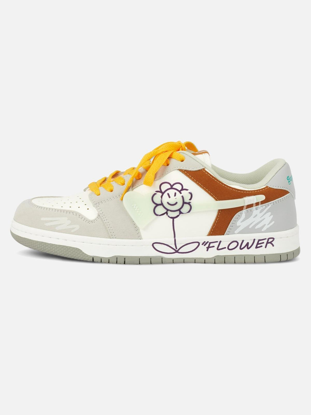Side view of TALISHKO skate shoes with yellow laces and a playful flower graphic design.