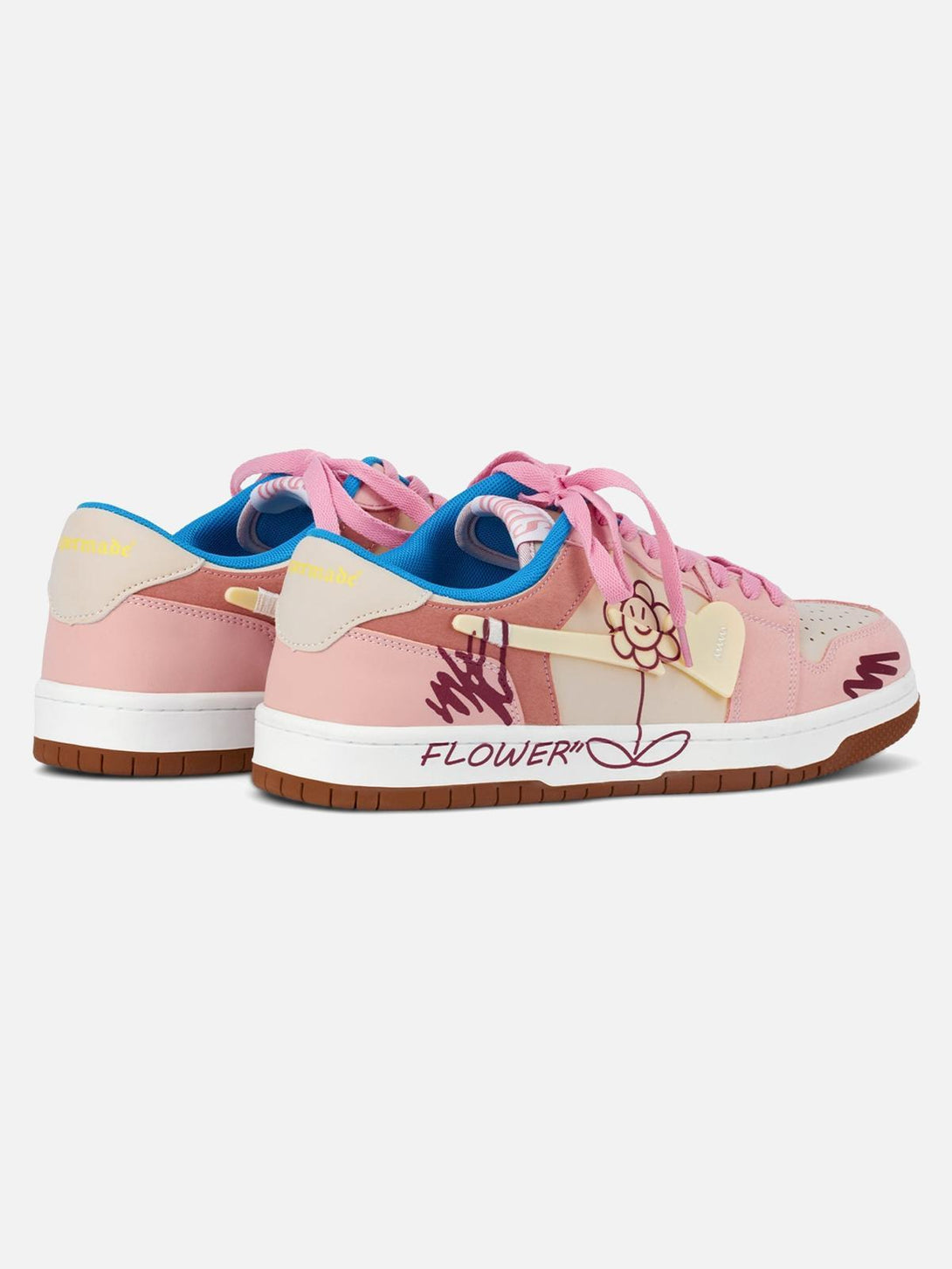 Back view of TALISHKO skate shoes in pink with fun flower graphics and vibrant blue accents.