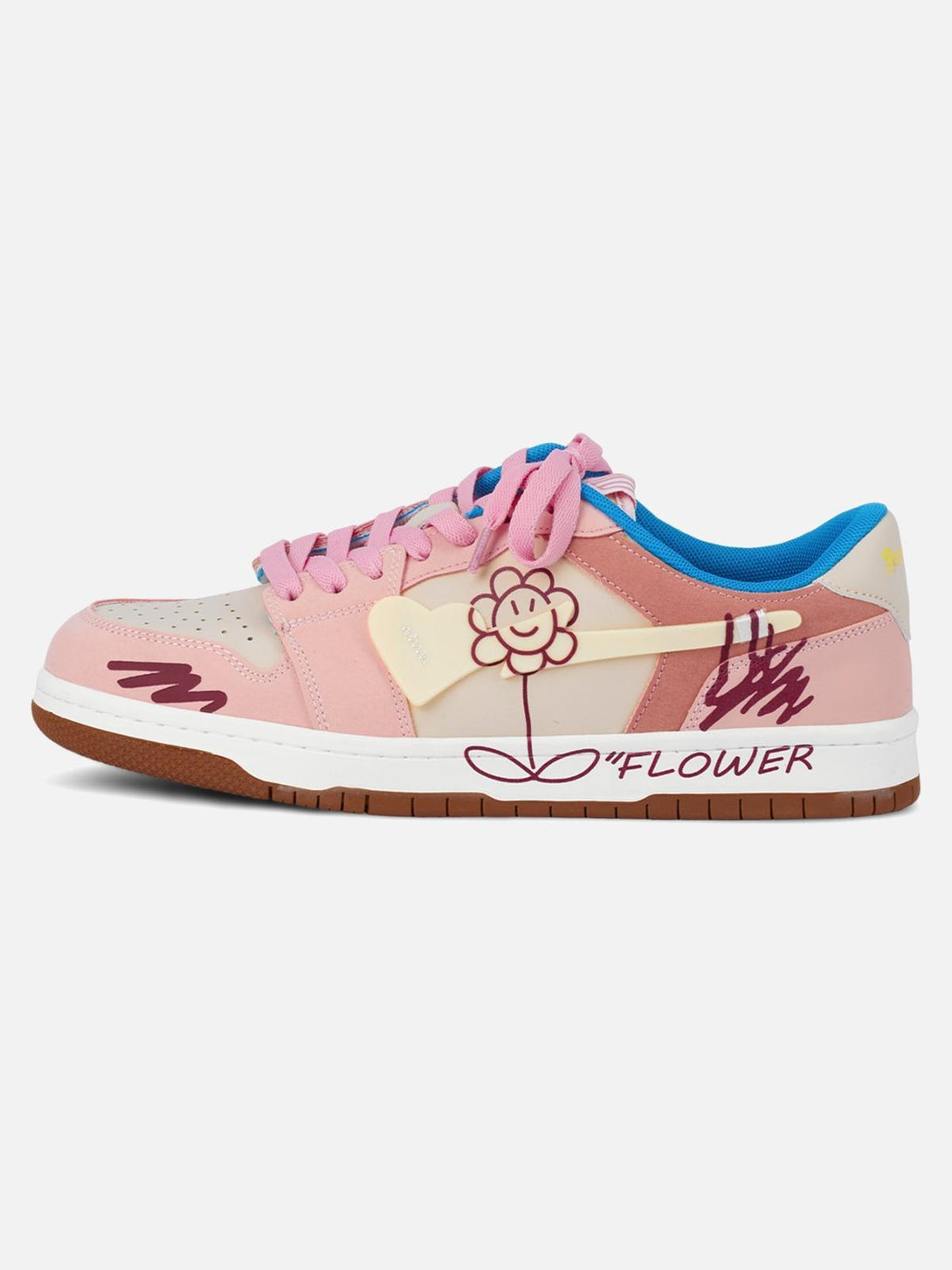 Side view of TALISHKO pink skate shoes featuring a cheerful flower graphic and unique design.