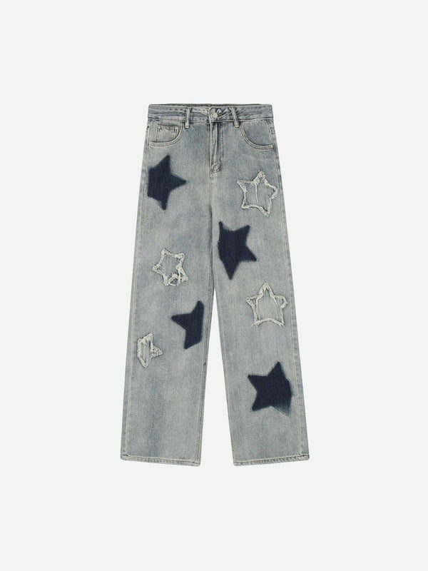 Front view of TALISHKO blue jeans featuring star appliques, perfect for modern street style.