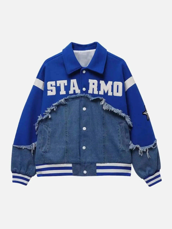 Front view of a blue denim and fabric spliced baseball jacket by TALISHKO, featuring bold lettering.