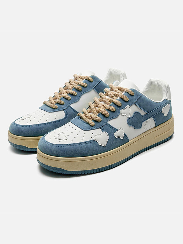 Retro blue casual shoes by TALISHKO with unique cloud patterns and rope laces, front view.