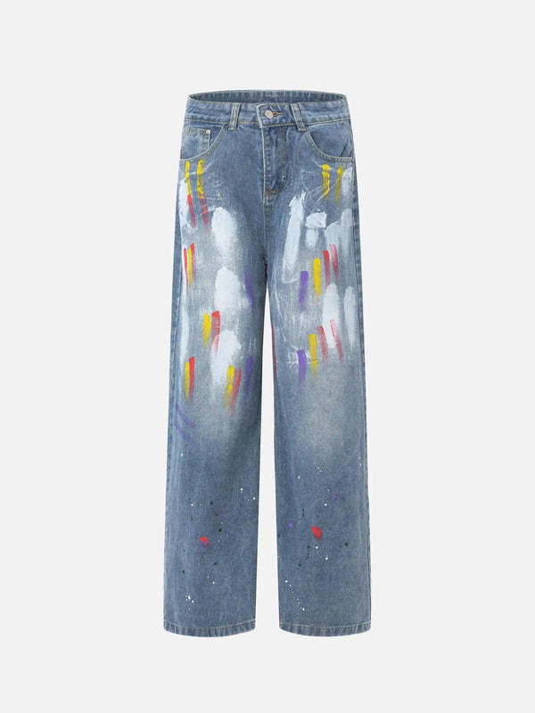 Front view of blue jeans with vibrant paint splatters, embodying TALISHKO's urban style.