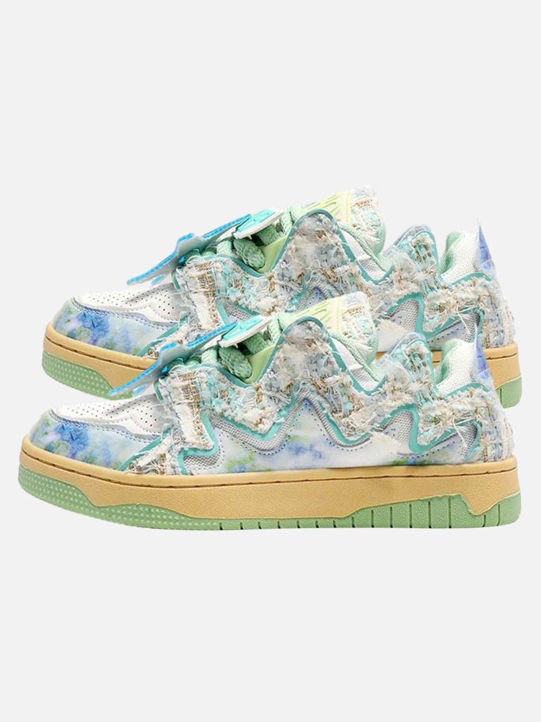 TALISHKO sneakers in pale green with textured details and mixed patterns, perfect for urban style.