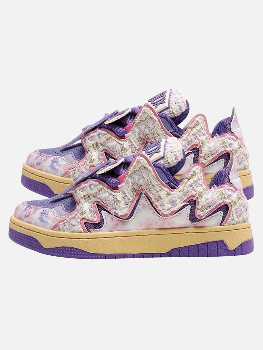 TALISHKO sneakers with vibrant purple zigzag patterns, offering a bold retro street vibe.