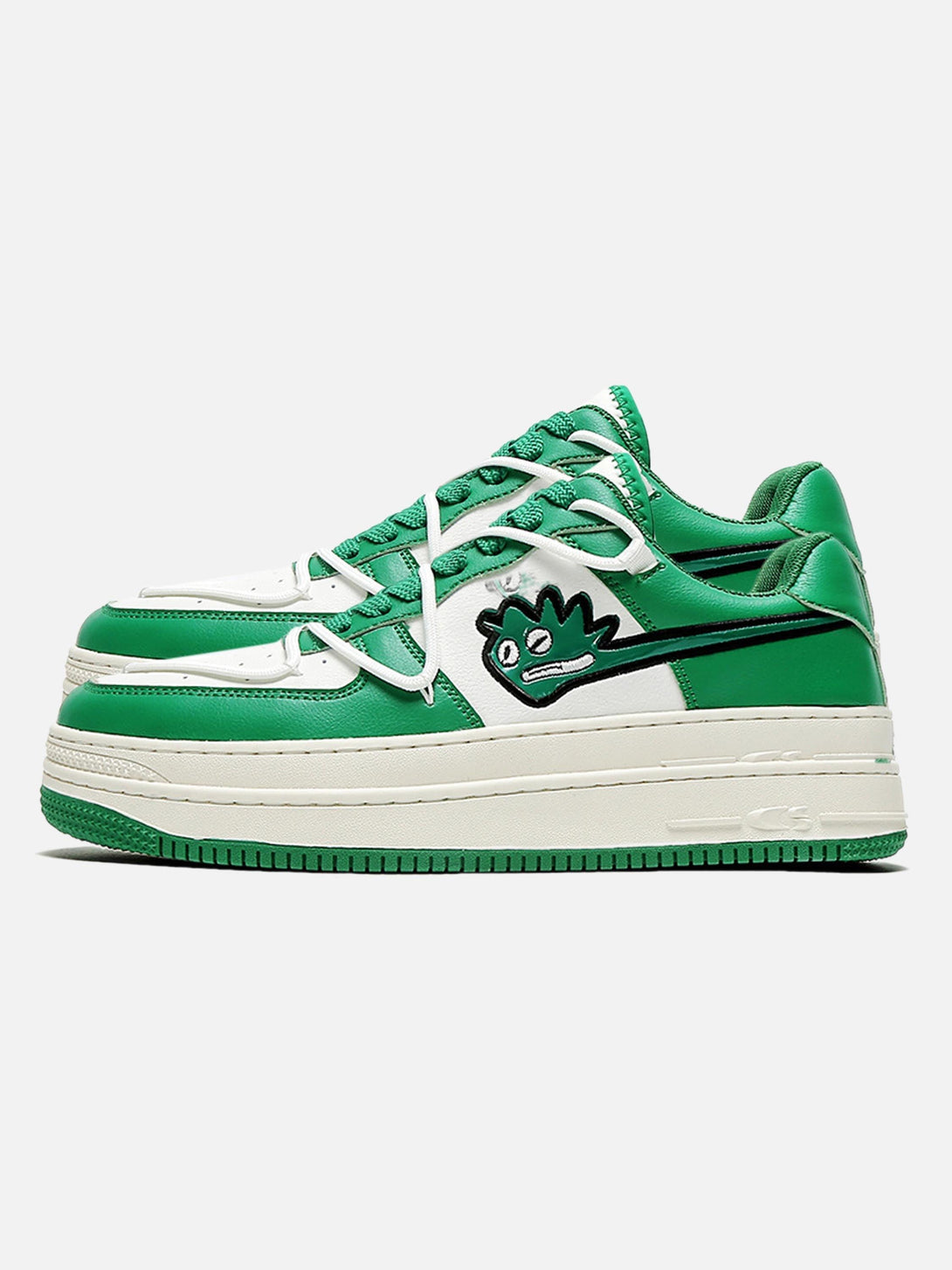 Green casual shoes with a playful monster graphic, side profile by TALISHKO.