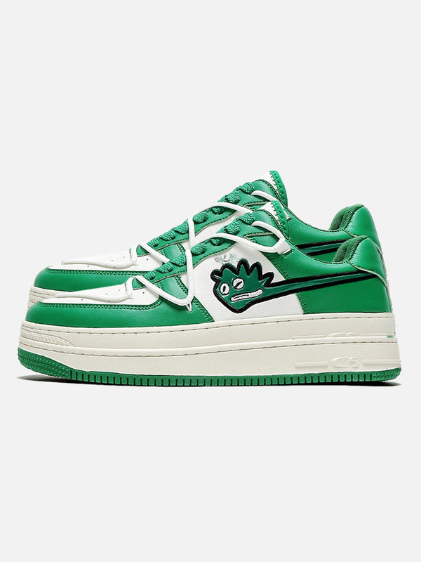 Green casual shoes with a playful monster graphic, side profile by TALISHKO.