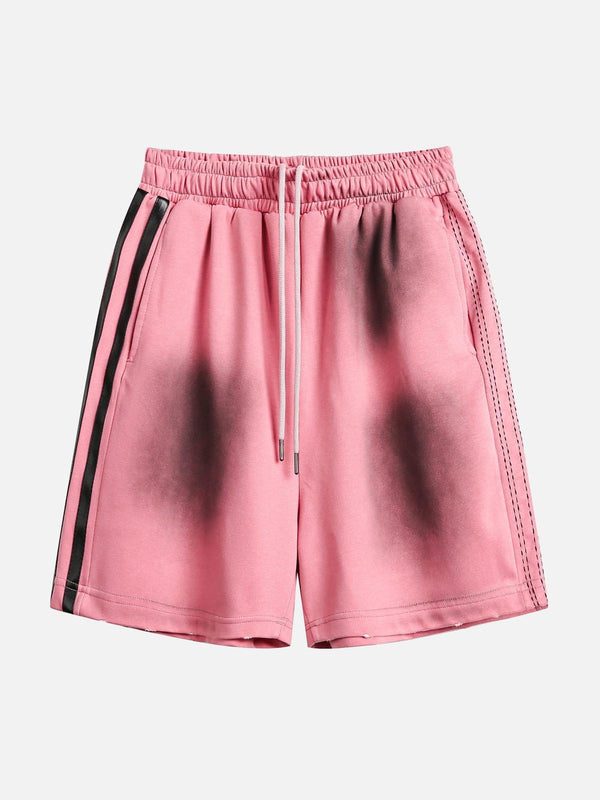 TALISHKO pink casual shorts with a spray paint design, front view showcasing unique style.