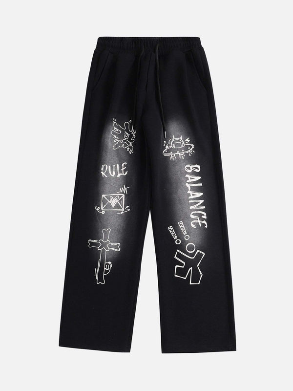 Front view of black TALISHKO sweatpants featuring spray-painted graphics and casual style.