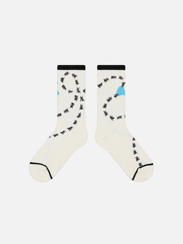 White mid-calf socks with black ant prints and blue accents by TALISHKO, front view.