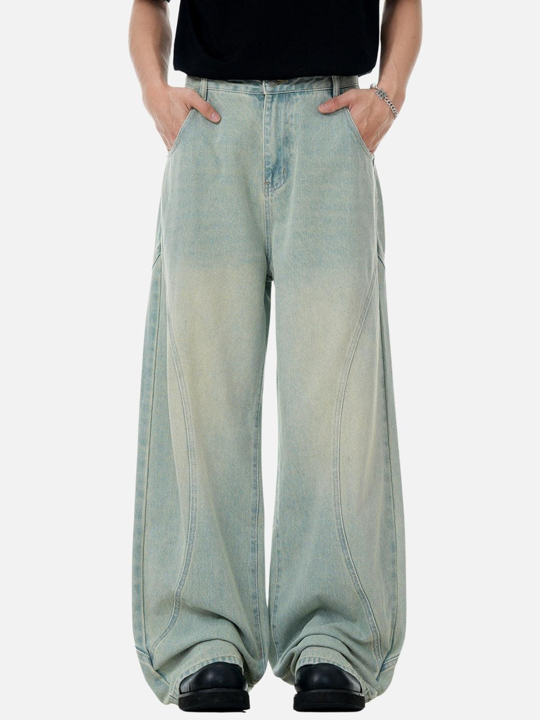 Front view of TALISHKO blue arc patchwork washed loose jeans, embodying casual street style.