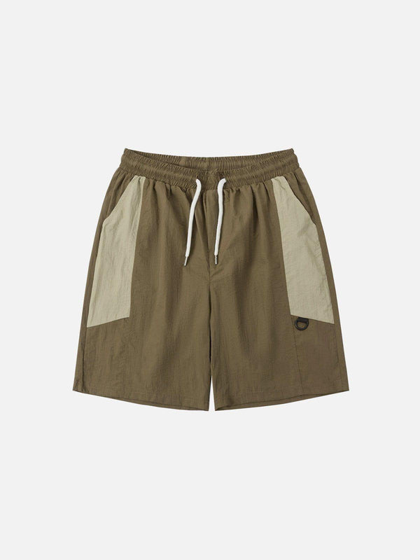 Front view of brown patchwork athleisure shorts by TALISHKO, highlighting casual style.