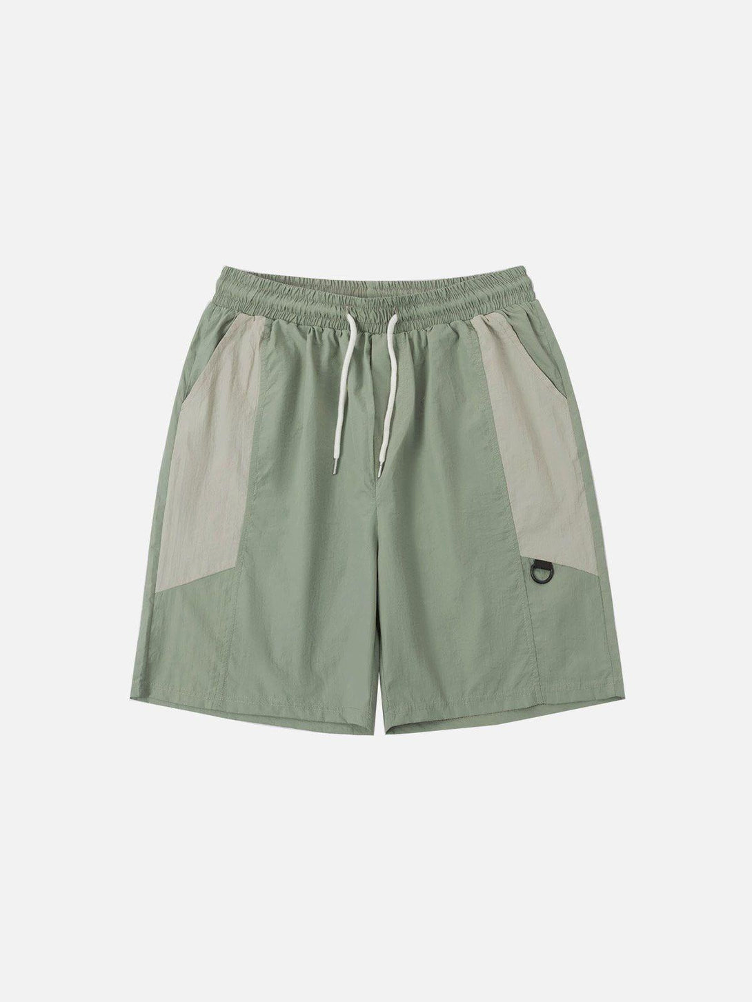 Front view of green patchwork athleisure shorts by TALISHKO, perfect for a relaxed vibe.