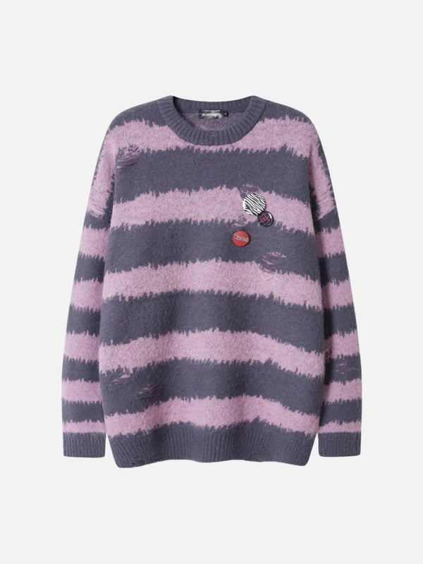 Front view of a pink striped sweater with badges and distressed details by TALISHKO.