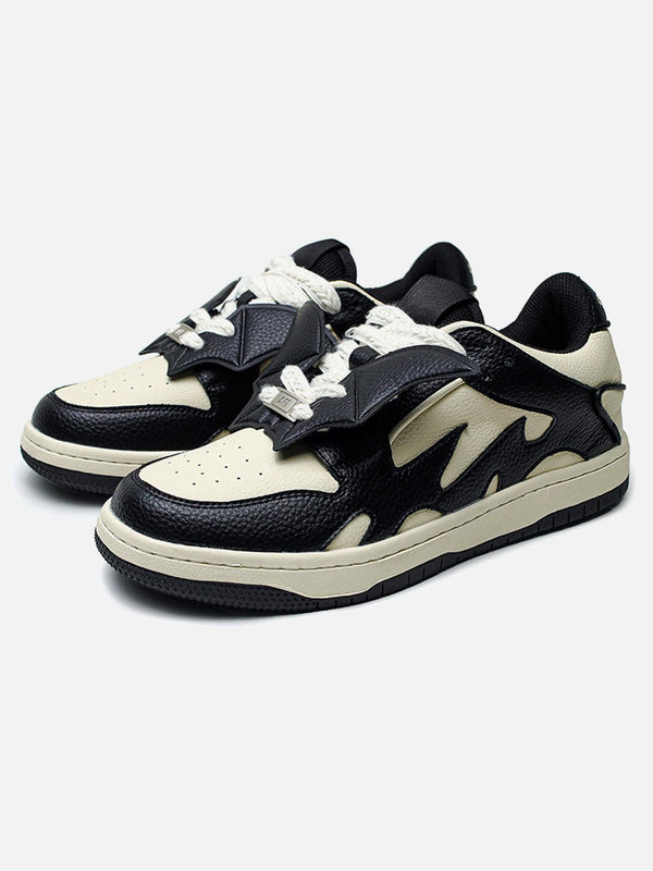 TALISHKO black and white skate shoes with bold contrast design, perfect for urban style.