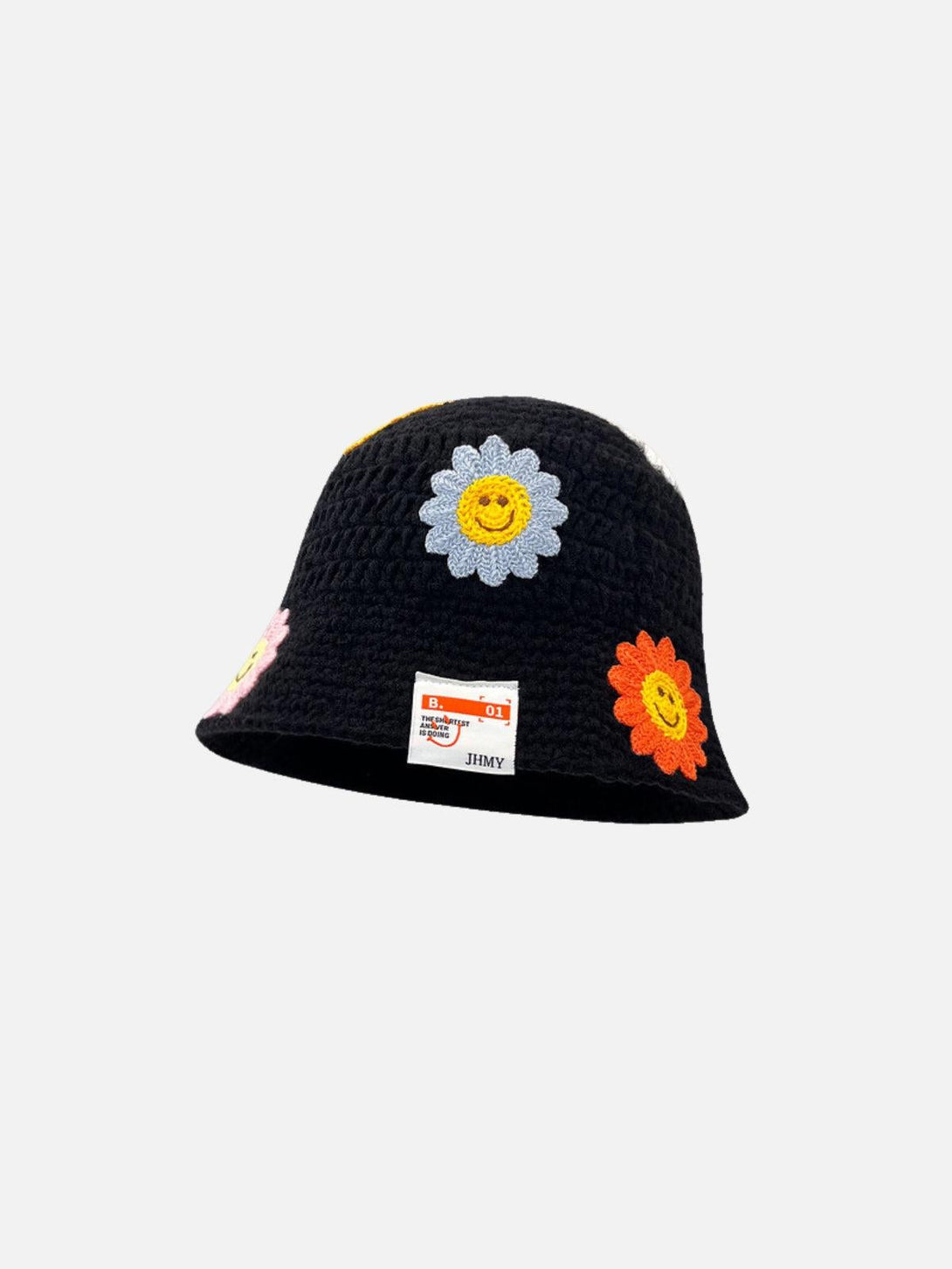 A black knit bucket hat by TALISHKO, adorned with colorful flower appliqués, front view.
