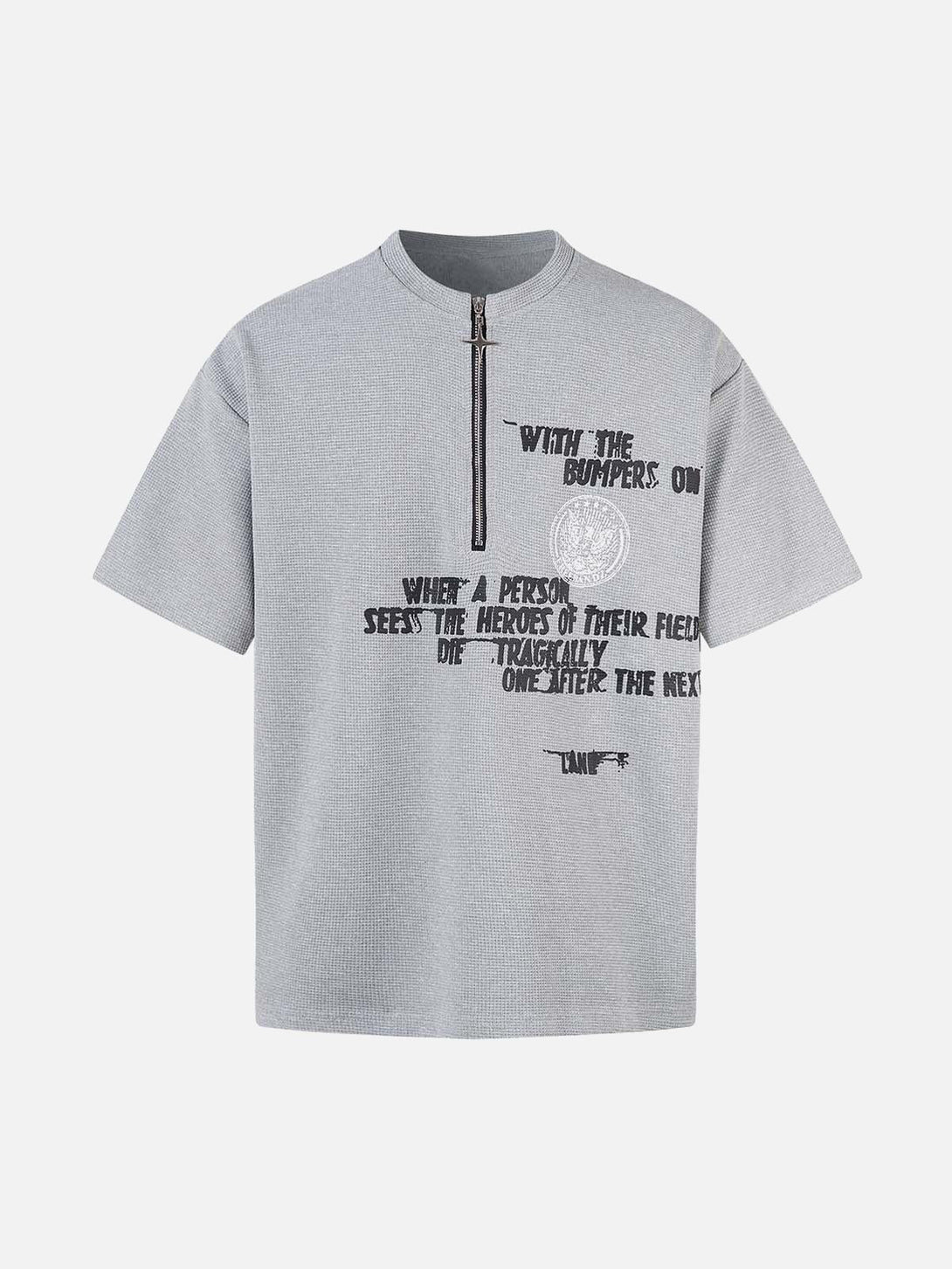 Front view of light gray graphic T-shirt by TALISHKO, featuring bold text and a zipper detail.