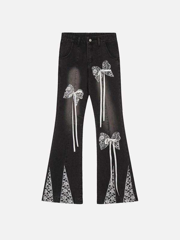 Front view of black bow-adorned jeans by TALISHKO, showcasing unique street-style design.