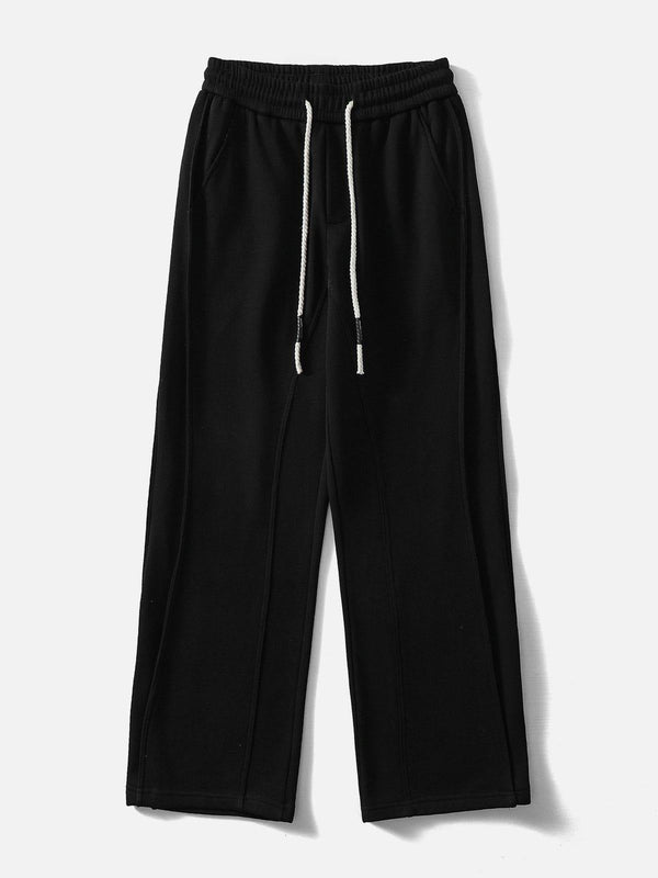 Black Camber Cutting Sweatpants by TALISHKO, front view with drawstring detail, ideal for casual urban style.