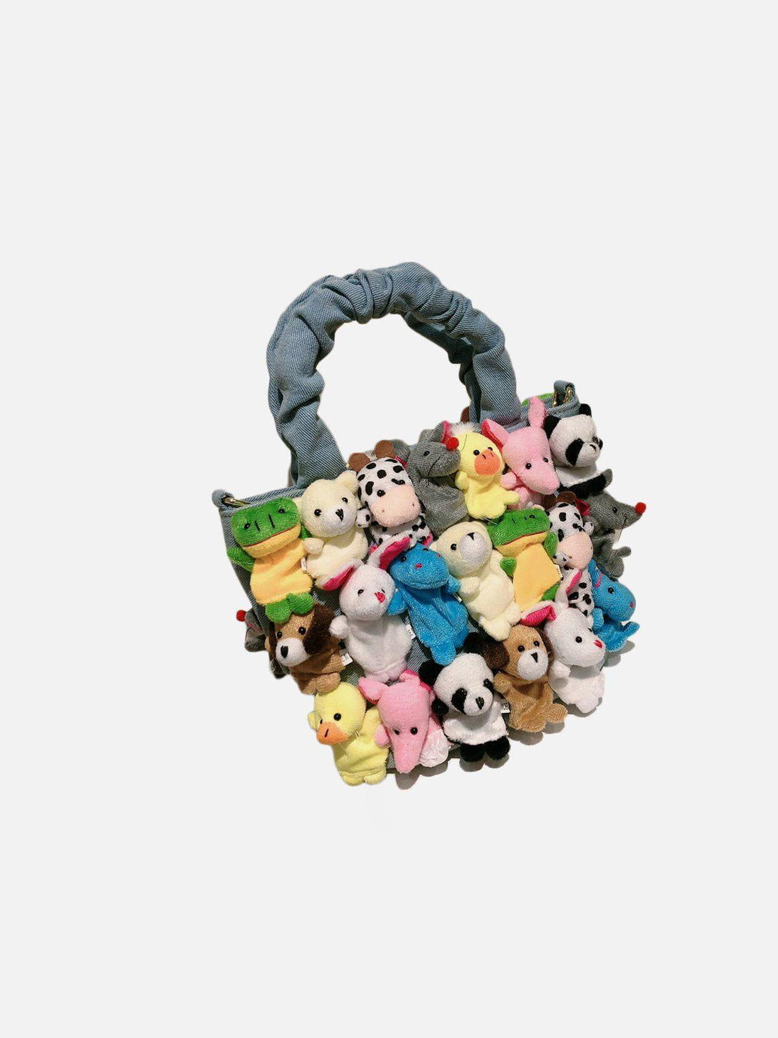 Whimsical blue bag by TALISHKO adorned with colorful cartoon dolls, perfect for playful style.