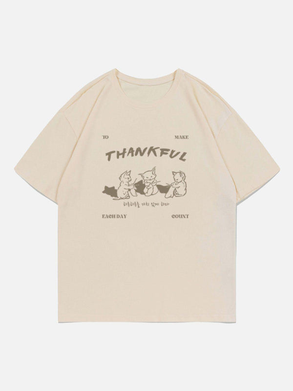 Apricot cartoon fox print tee by TALISHKO, front view showcasing playful design and relaxed fit.