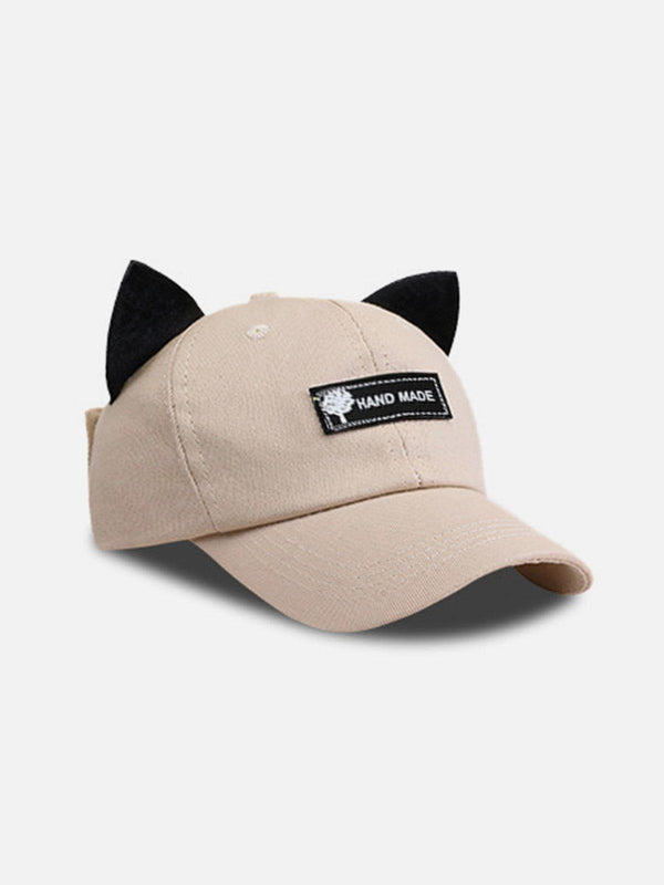 Beige baseball hat with cat ears and a unique patch, designed by TALISHKO.