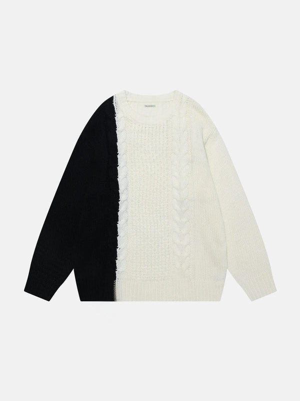 Front view of a TALISHKO color-blocking sweater, featuring bold black and white patchwork.