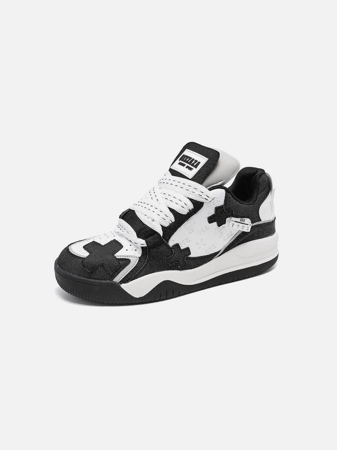 Front view of black and white TALISHKO skate shoes with bold cross detailing for urban style.