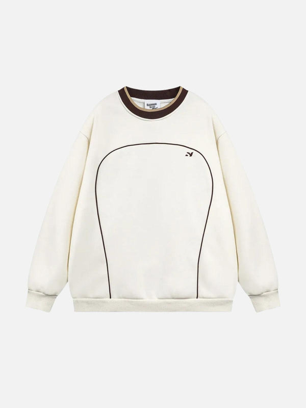 Front view of a beige TALISHKO sweatshirt featuring contrast paneled embroidery.