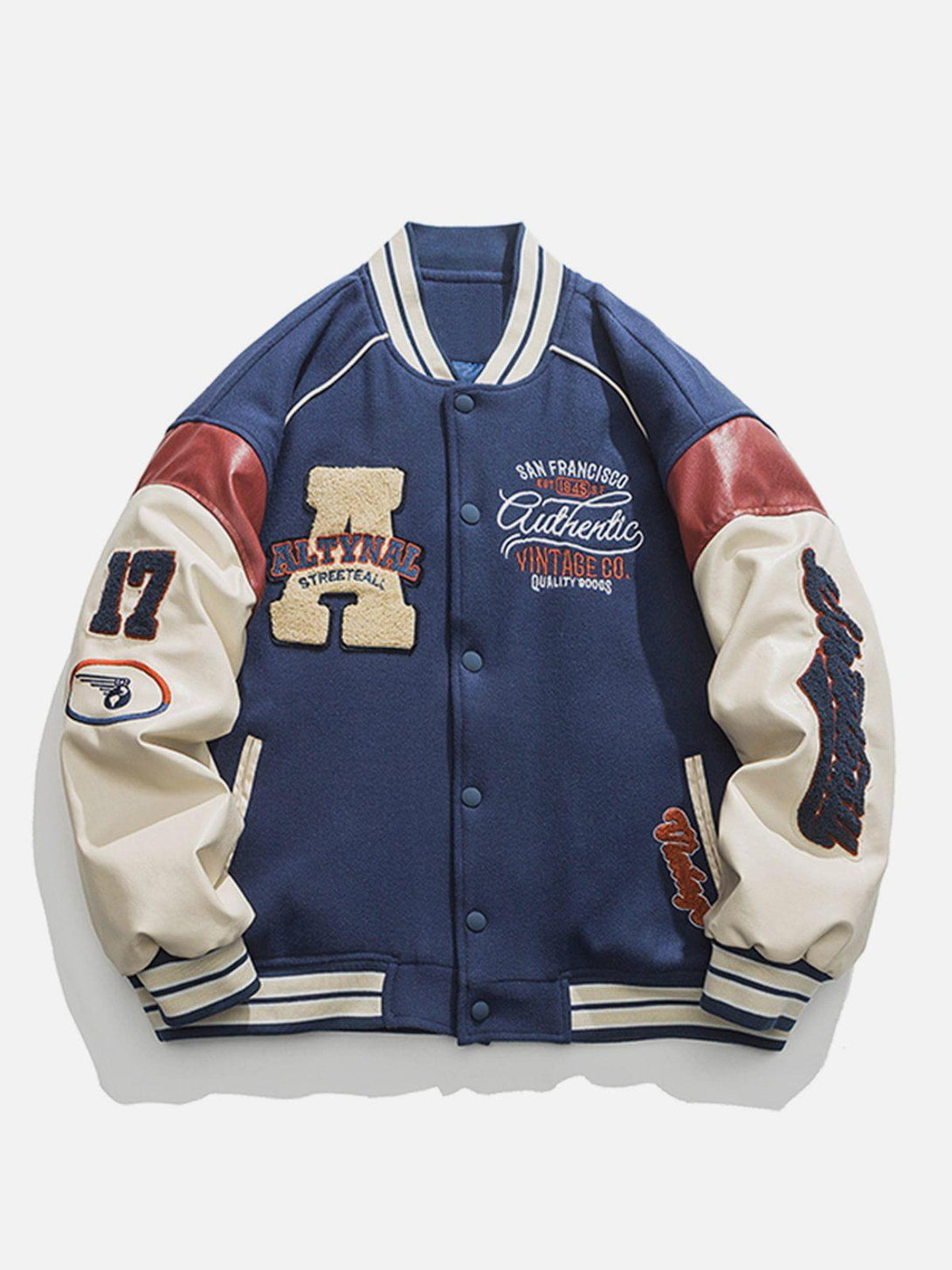 Navy varsity jacket by TALISHKO with bold patches and contrast stitching, front view.