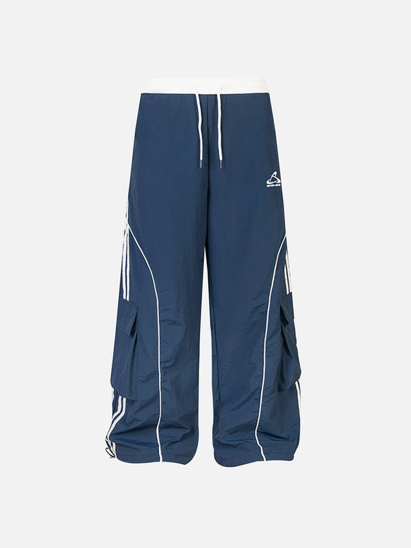 Navy sweatpants with contrast stripes and drawstring waist, front view by TALISHKO.