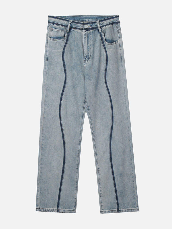 Front view of blue curve patchwork jeans by TALISHKO, showcasing unique streetwear style.