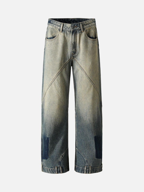 Front view of TALISHKO deconstructed straight jeans in blue with unique ankle loop details.