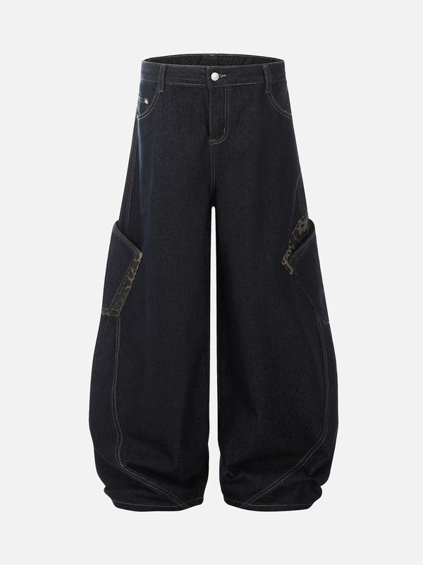 Front view of dark blue baggy barrel jeans with cheetah print pockets by TALISHKO.