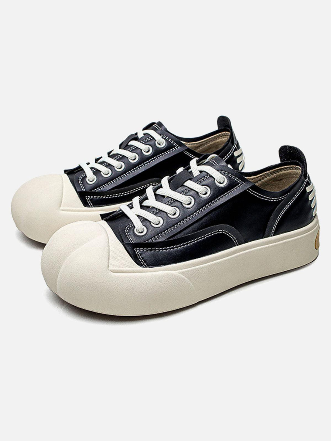 Black deconstructed PU leather casual shoes by TALISHKO, featuring a unique front view design.