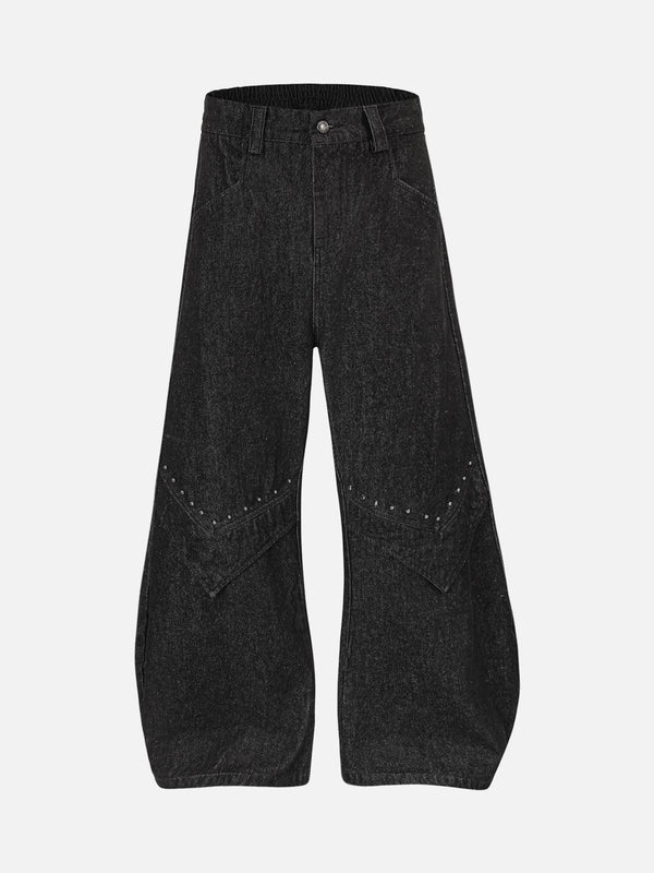 Front view of TALISHKO black deconstructed jeans with rivet detailing, perfect for urban style.