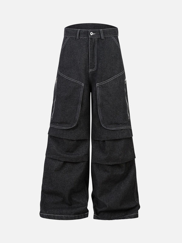 Front view of black deconstructed jeans by TALISHKO, featuring pleats and large pockets.