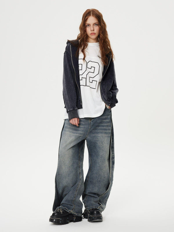 Model wearing TALISHKO's deconstruction patchwork washed loose jeans in a casual street style.