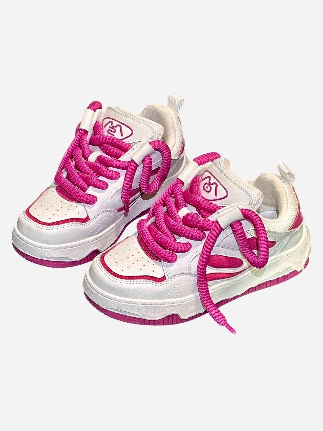White and pink sneakers by TALISHKO with bold laces, perfect for a trendy streetwear look.