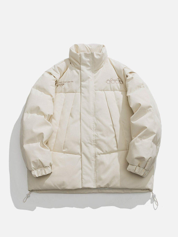 Front view of a beige detachable sleeve winter coat by TALISHKO, showcasing a trendy design.