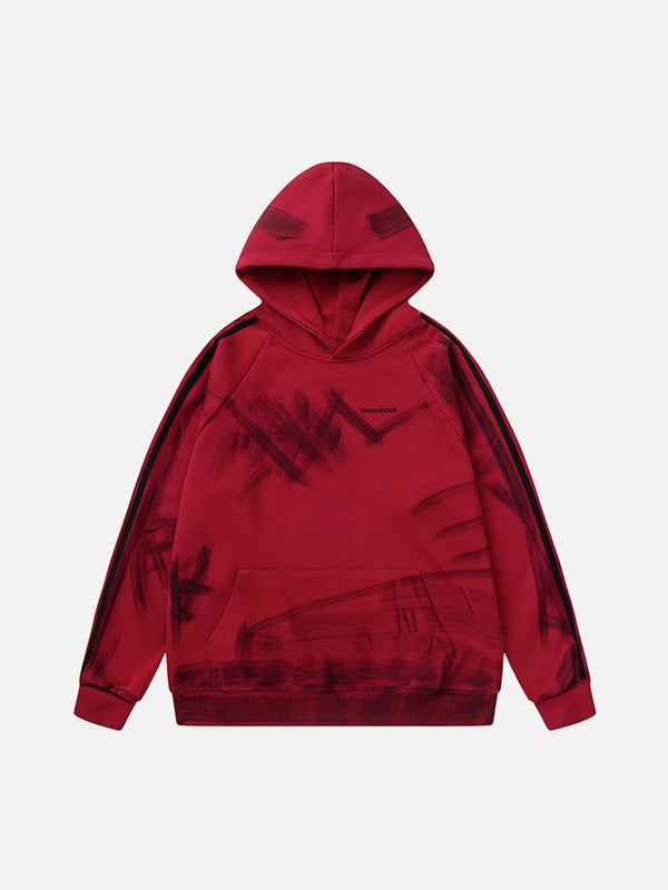 Front view of a red graffiti-style hoodie by TALISHKO, featuring bold brushstroke patterns.