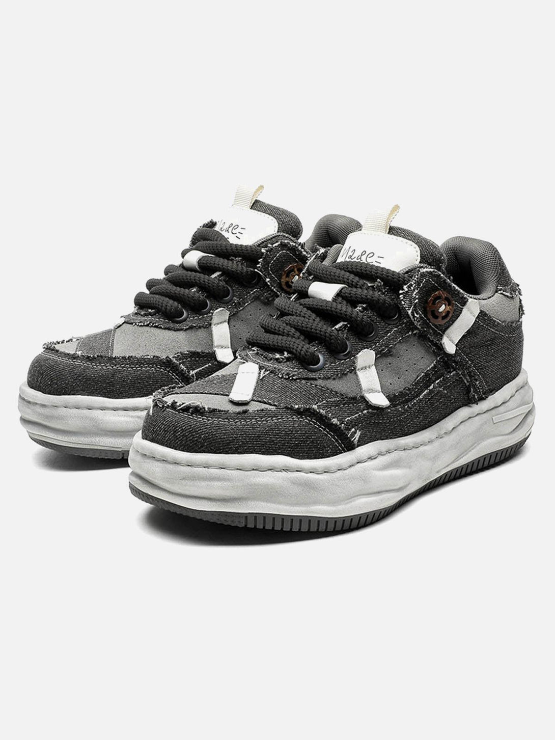 Front view of gray distressed platform sneakers by TALISHKO, featuring a deconstructed design.