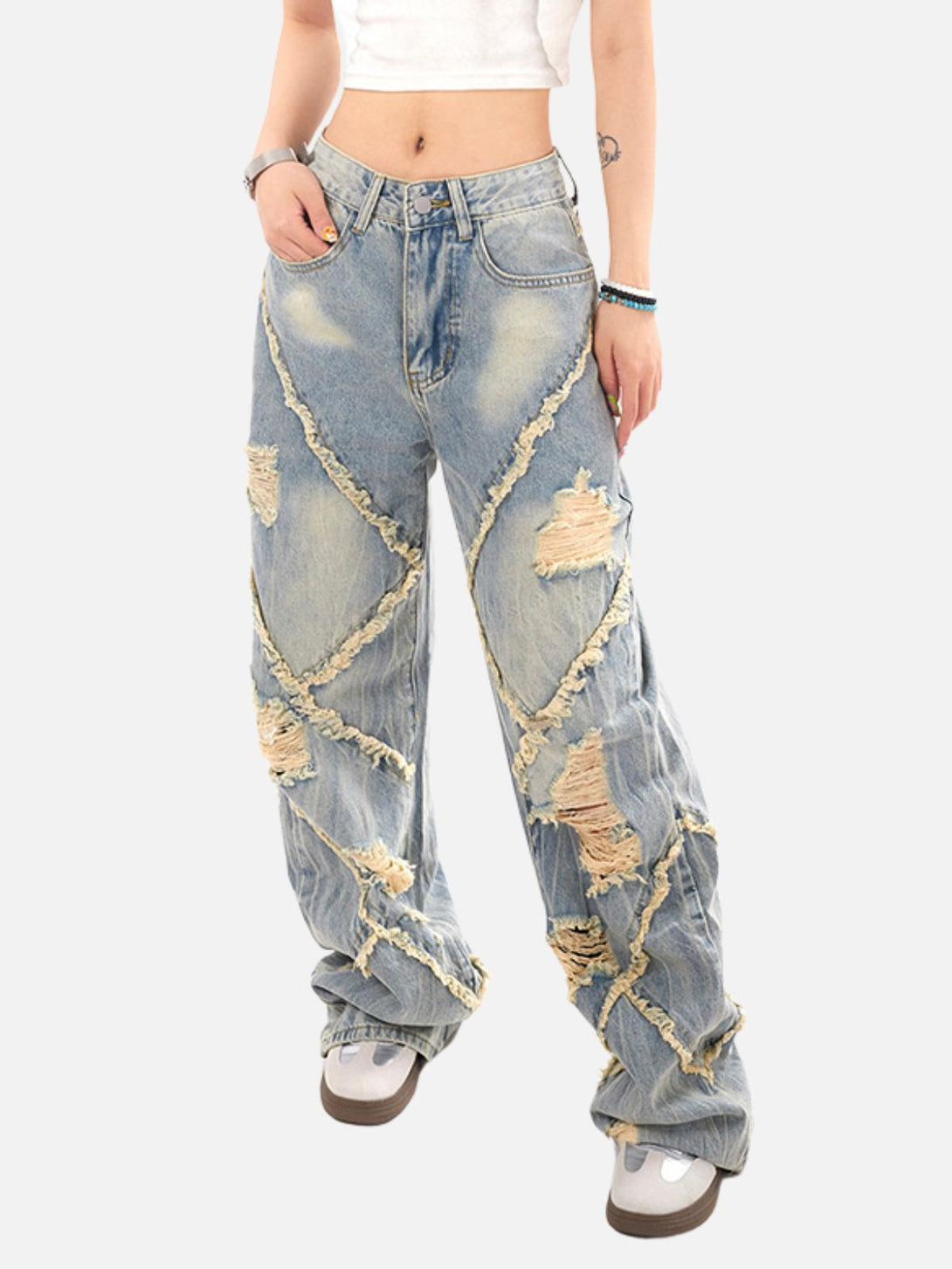 Model wearing blue distressed fringe loose jeans by TALISHKO, showcasing a bold street style.