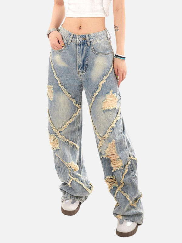 Model wearing blue distressed fringe loose jeans by TALISHKO, showcasing a bold street style.