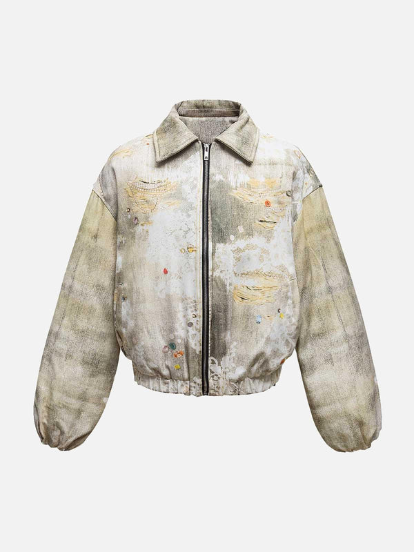 Front view of a beige quilted bomber jacket by TALISHKO, featuring a distressed graffiti design.