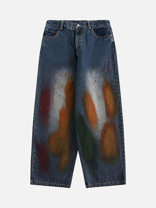 Front view of dark blue TALISHKO straight jeans with colorful graffiti-style accents.