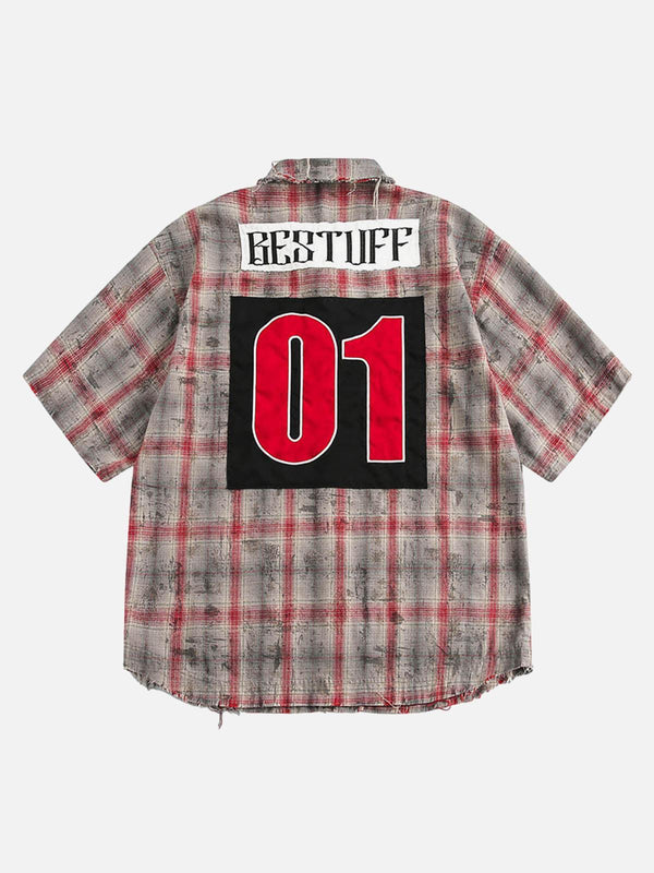 Back view of a red plaid distressed short-sleeve shirt with bold patches by TALISHKO.